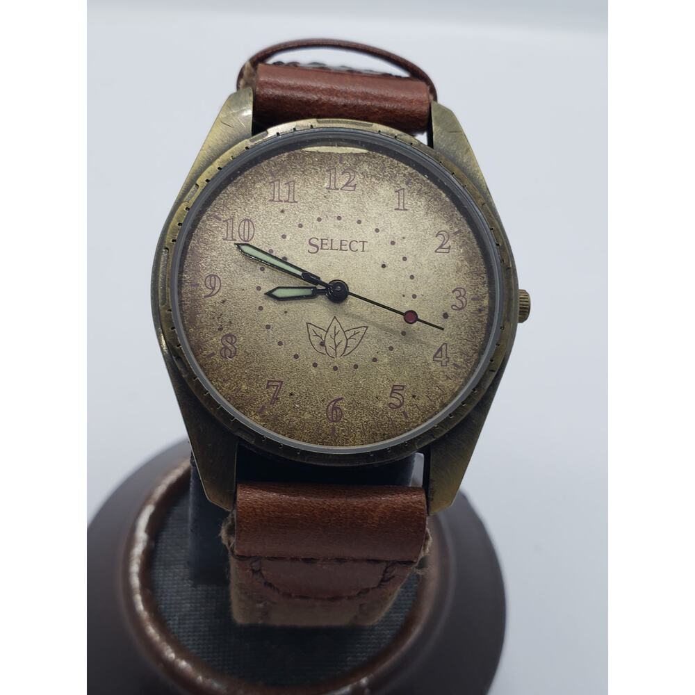 Select women's watch. Large face, Small leaves on watch face.